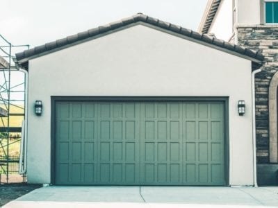 Modern home garage with teal painted doors