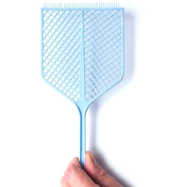 closeup of fly swatter in hand on white background