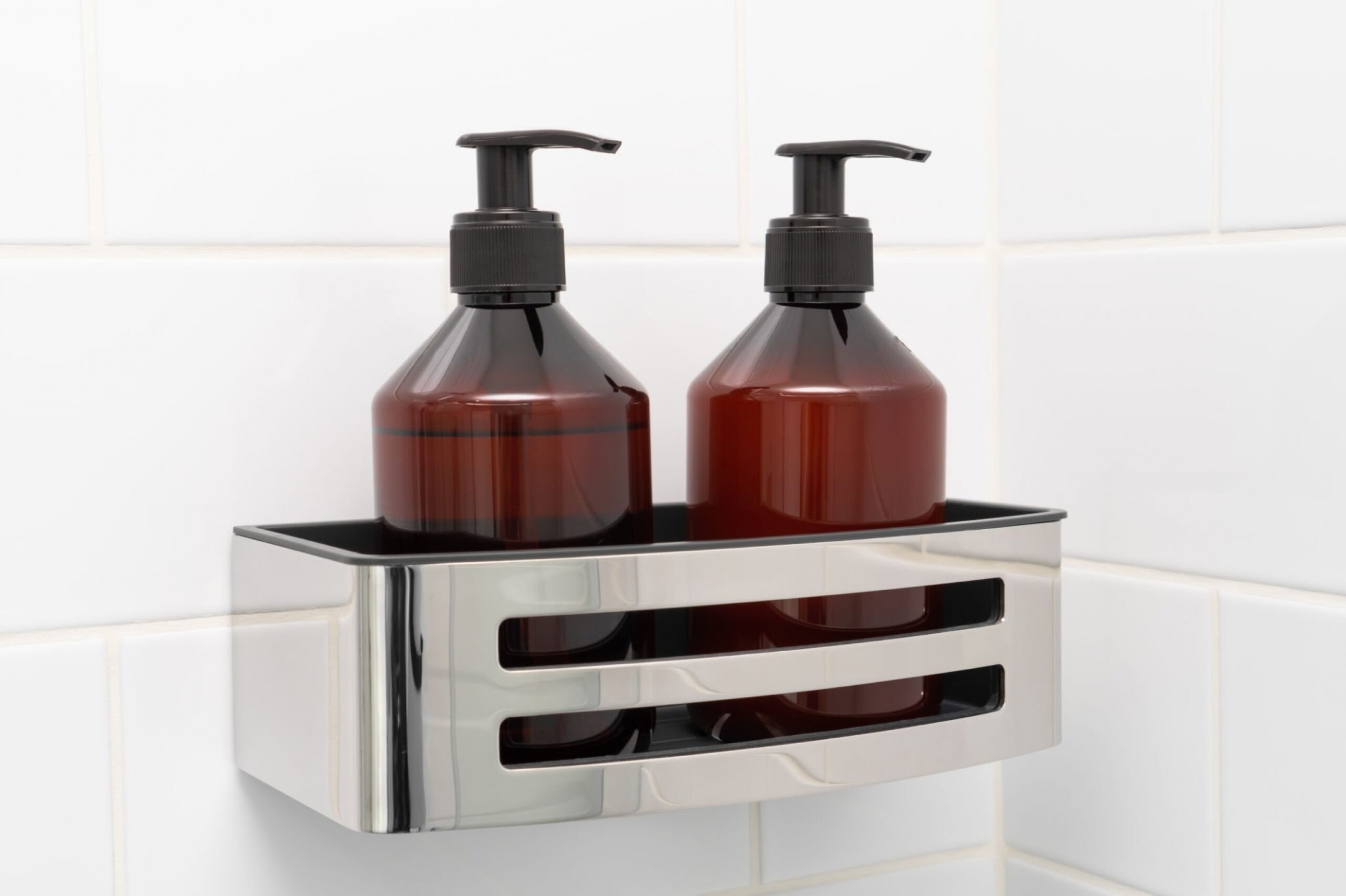 Shower rack with bottle of shampoo and conditioner