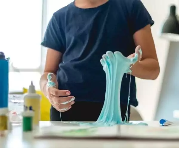 Kid playing with slime