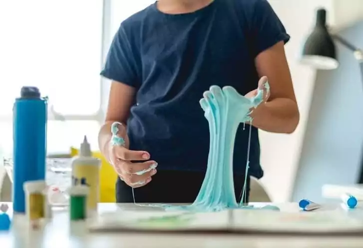 Kid playing with slime
