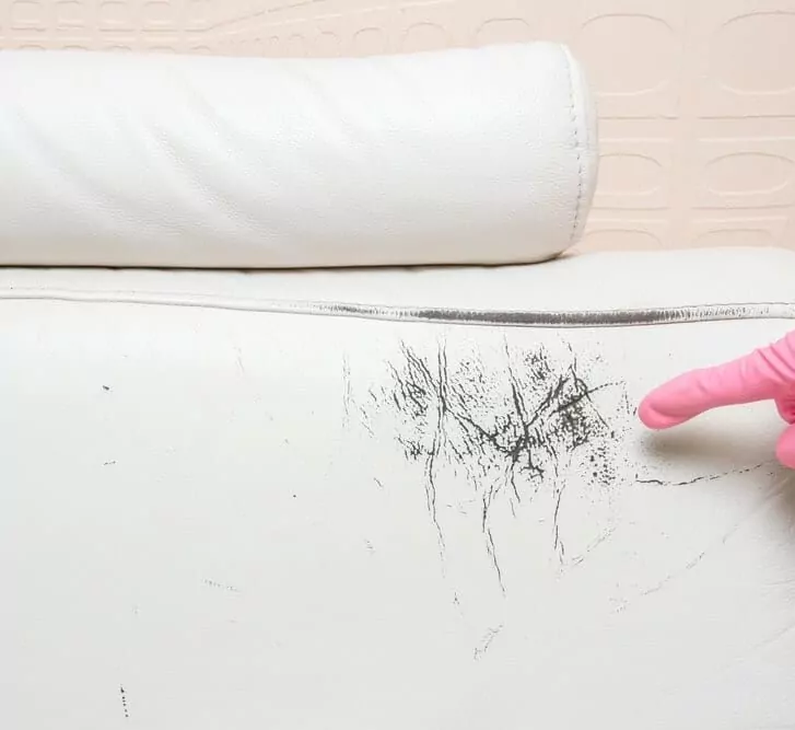 Leather stains on white couch