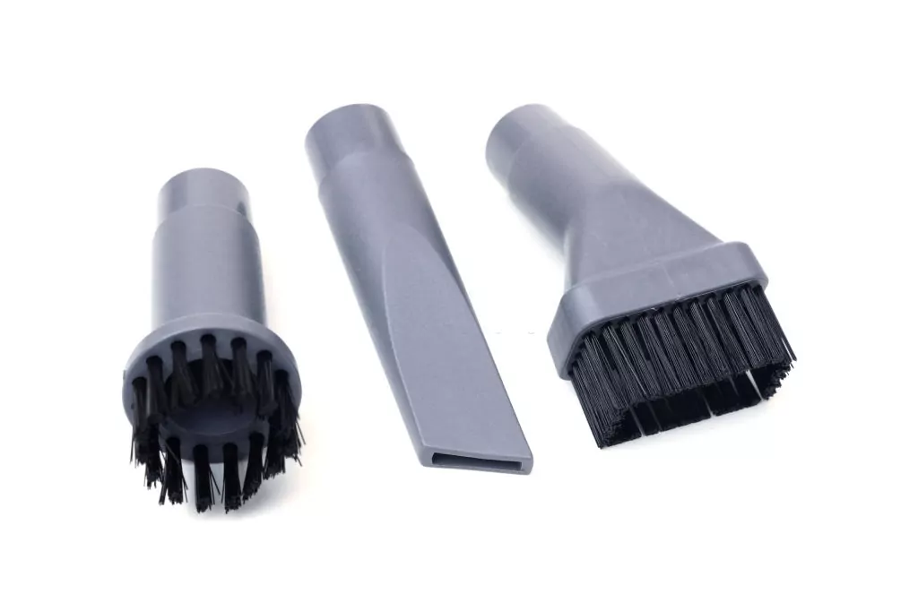 Different types of vacuum cleaner head brushes and tubes for different tasks