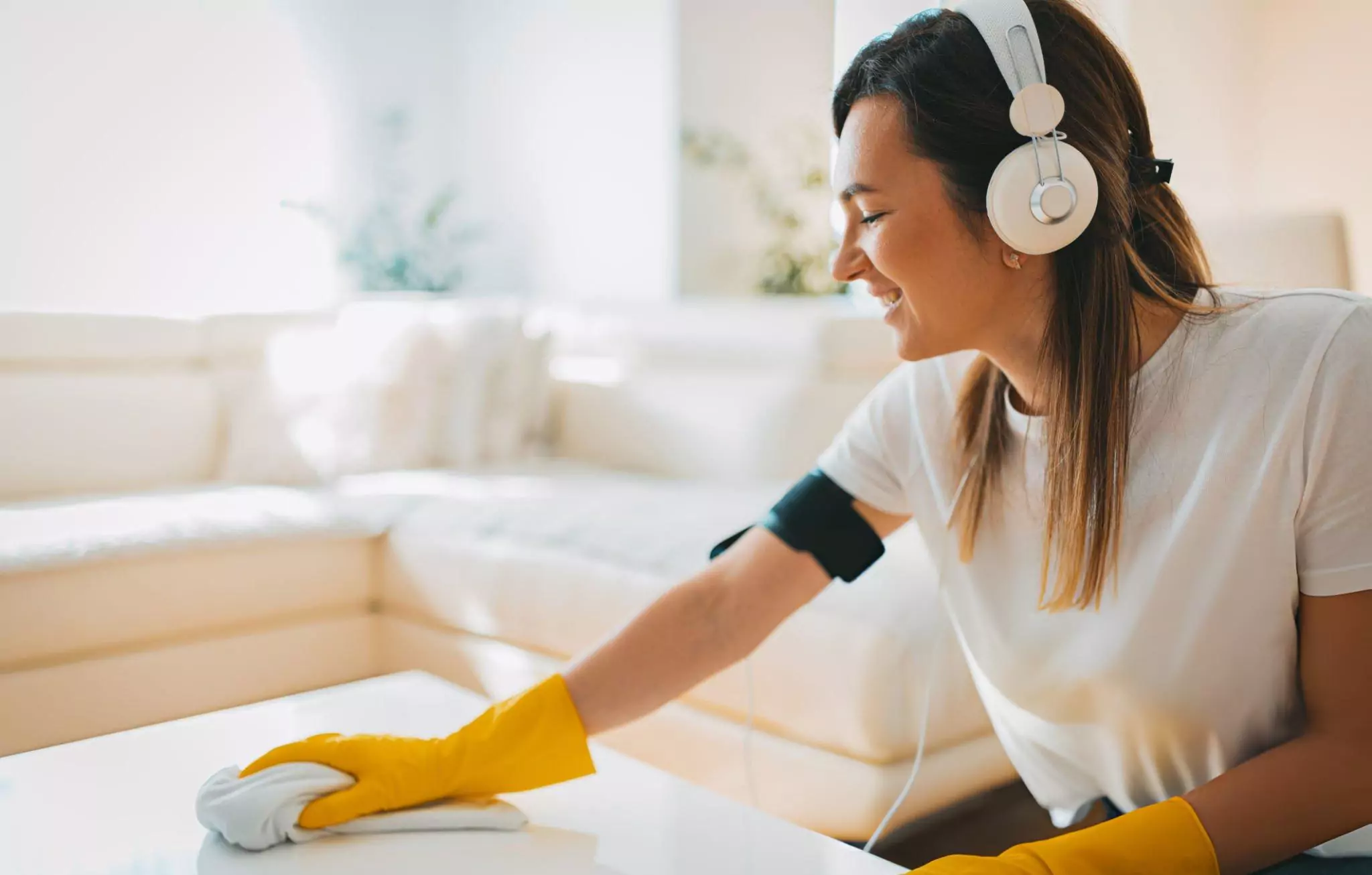 Cleaning Motivation Cleanzen Image of a Woman Listens to Music on Headphones While Cleaning