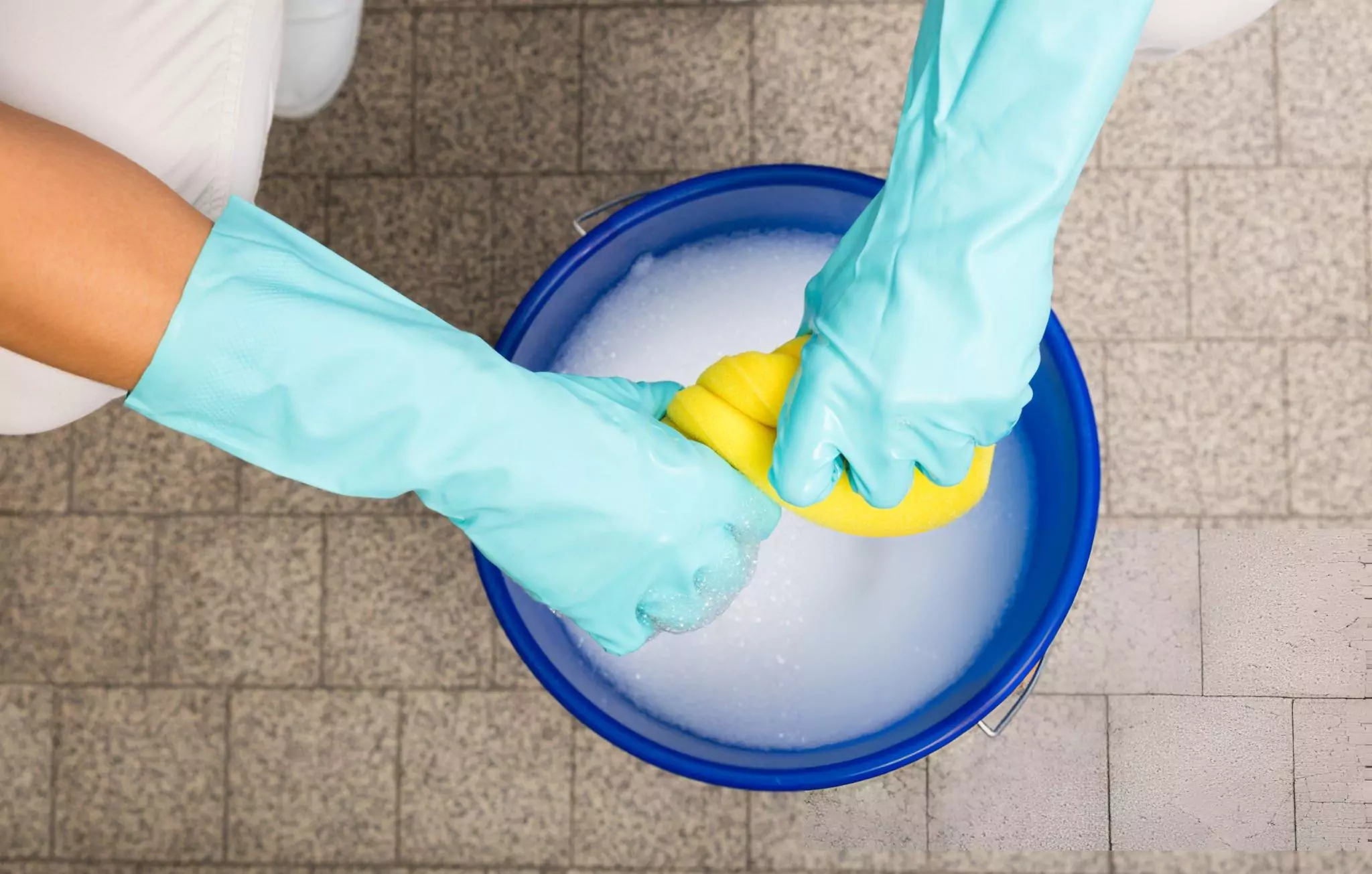 How to Remove Oil Stains From Driveway Cleanzen Image of a Bucket of Soapy Water