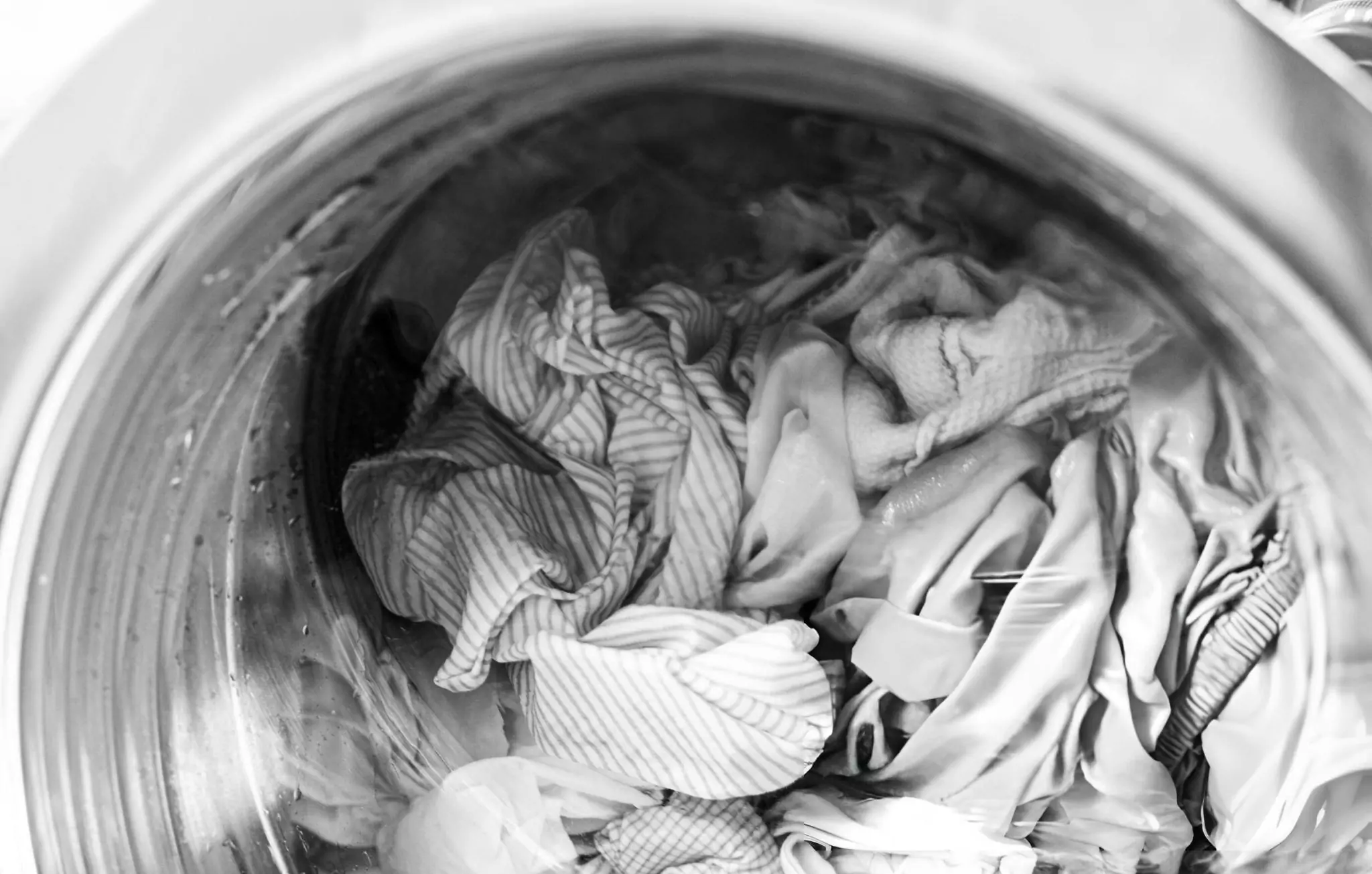 Simple Trick to Eliminate Dust in Your House Cleanzen Image of a Bedlinens Inside the Washing Machine