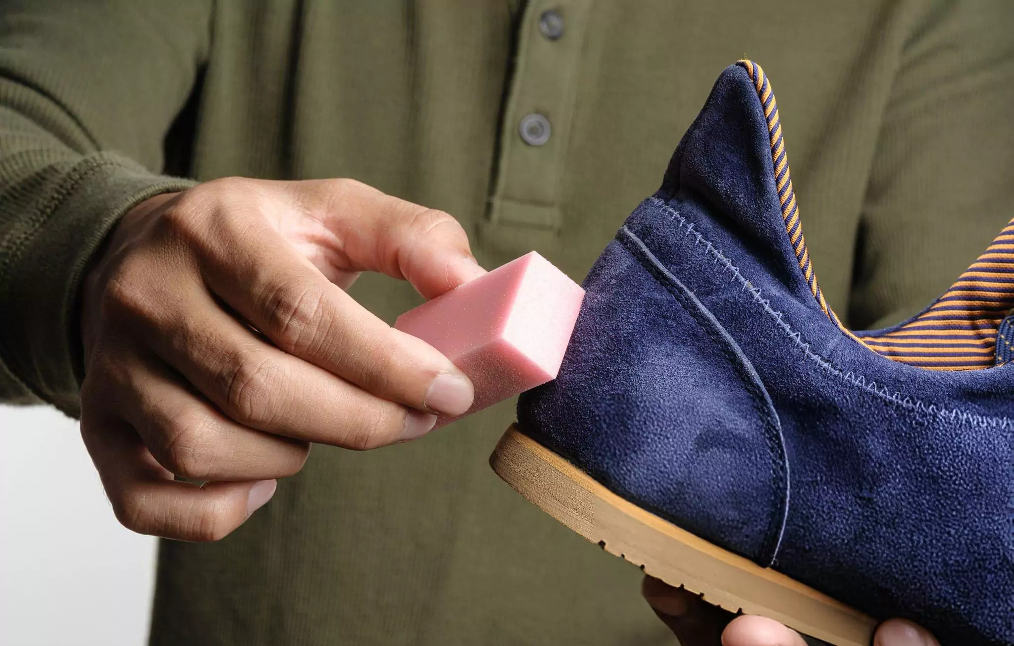 How to Clean Suede Shoes Cleanzen Image of a Man Using Suede Eraser
