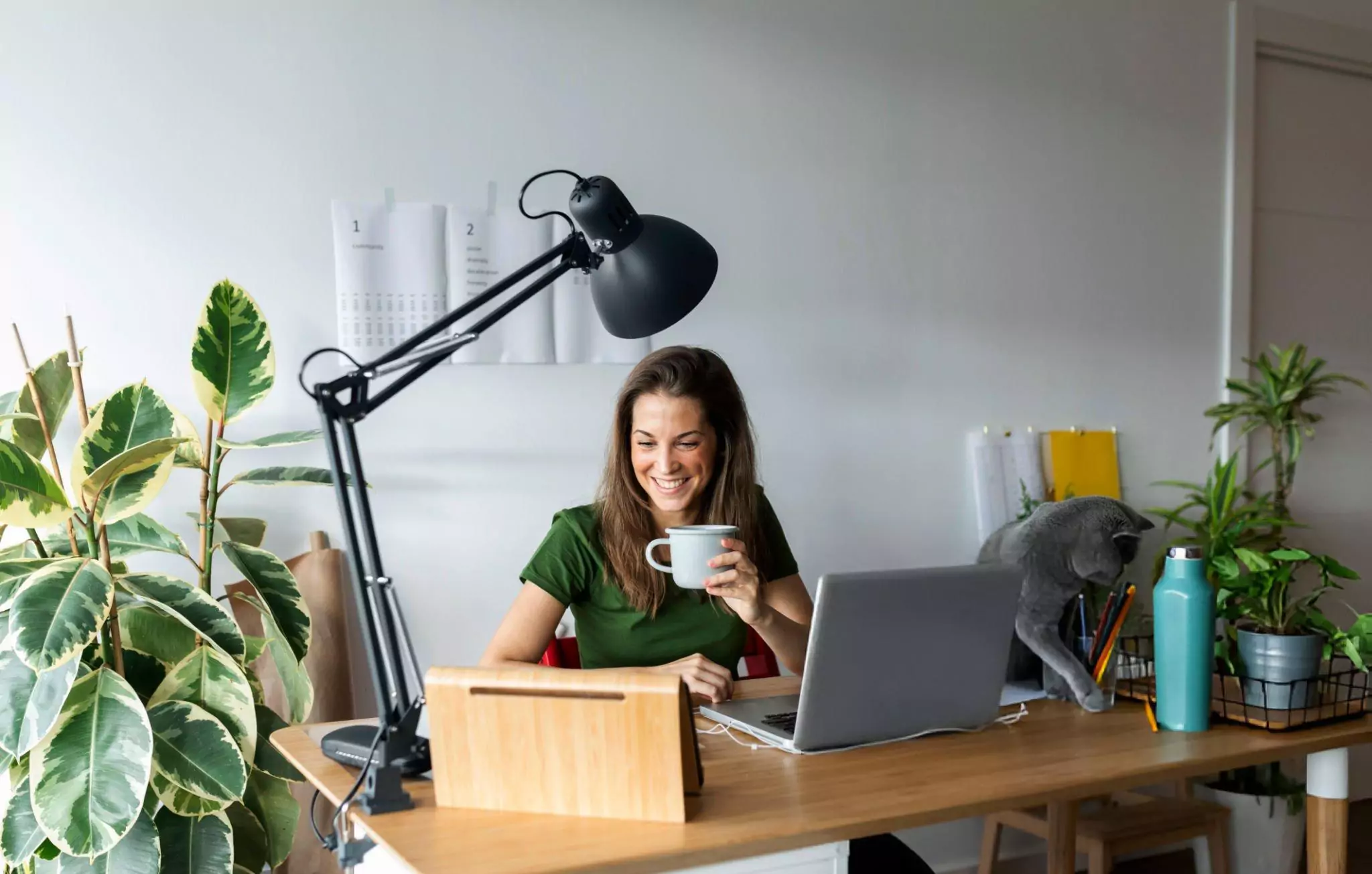 How to Keep Your Home Office Clean and Tidy Cleanzen Image of a Happy Woman Working From Home