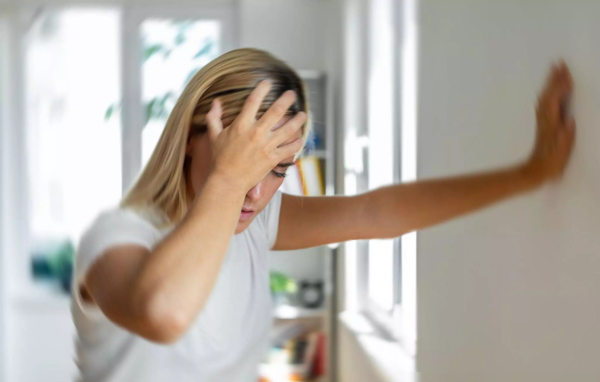 What Does Black Mold Look Like Cleanzen Image of Woman Feeling Ddizzy At Home