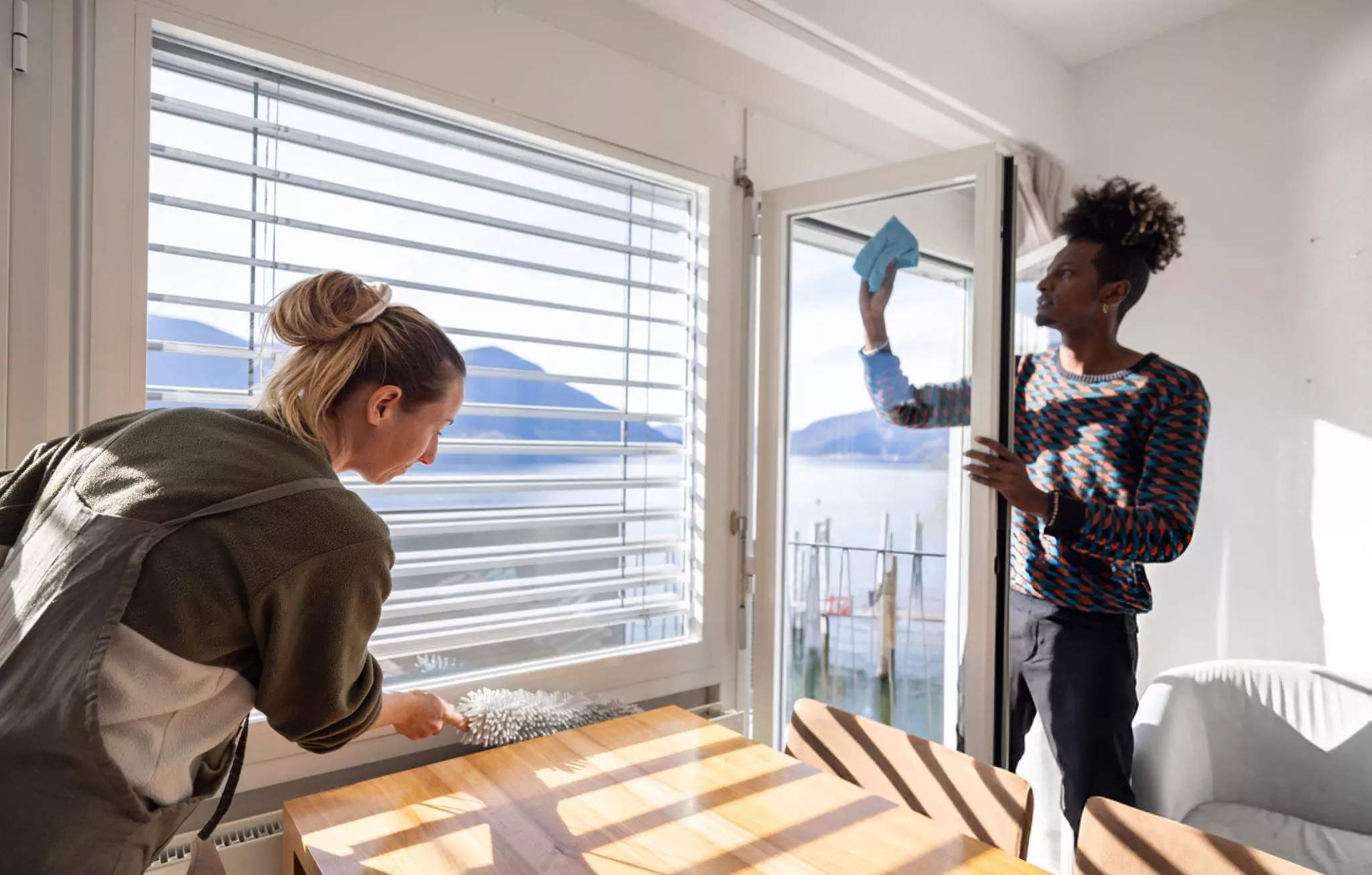 How to Clean Windows Cleanzen Image of Two Cleaners Cleaning Windows and Glass Door