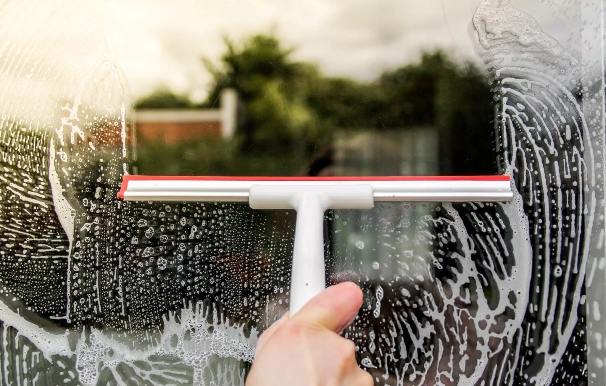 How to Clean Windows Cleanzen Image of a Squeegee for Window Cleaning