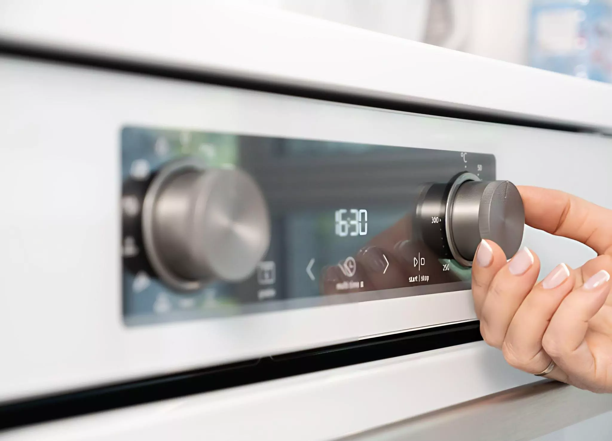 Self Cleaning Oven Cleanzen Image of a Woman's Hand Setting Up the Oven